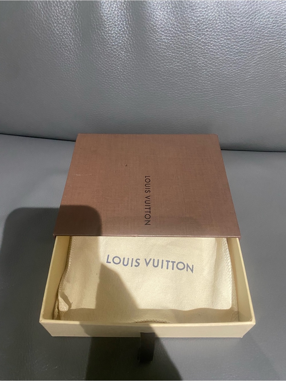 Boxes wallets dust bags L.V